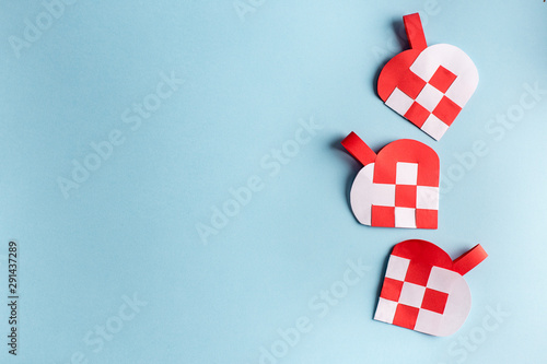 Traditional and typical Christmas Danish decoration made of paper woven heart