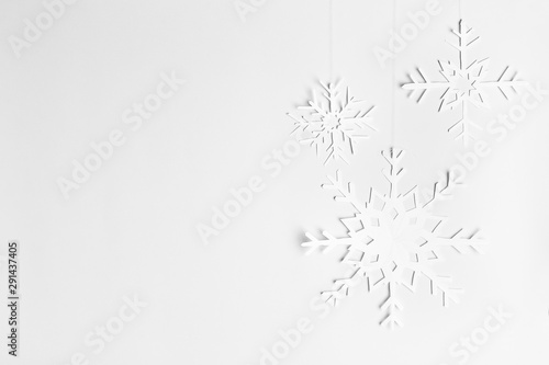 background with hanging paper snowflakes, homemade