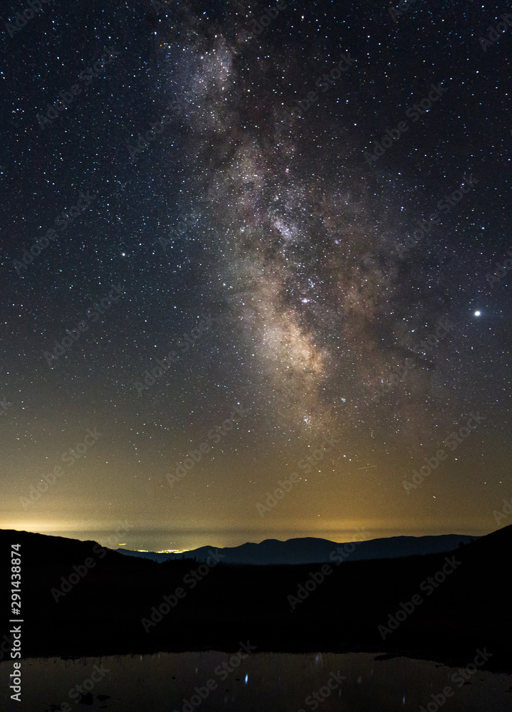 The milky way. Night stars landscape mountain view.