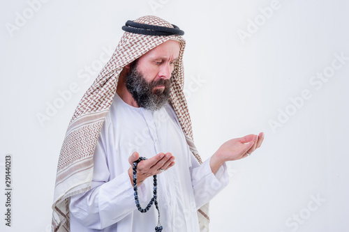 фотографія Praying hands of an old arabic man.Indoor picture.
