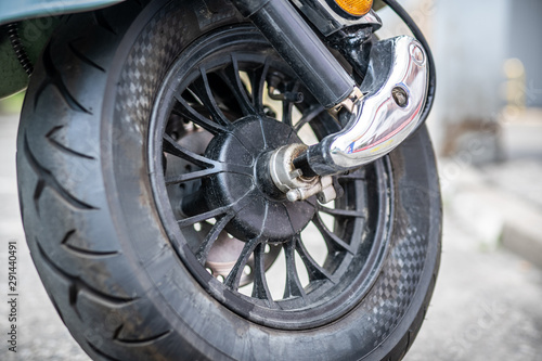 Front wheel of electric motorbike scooter.  © Pratiwi