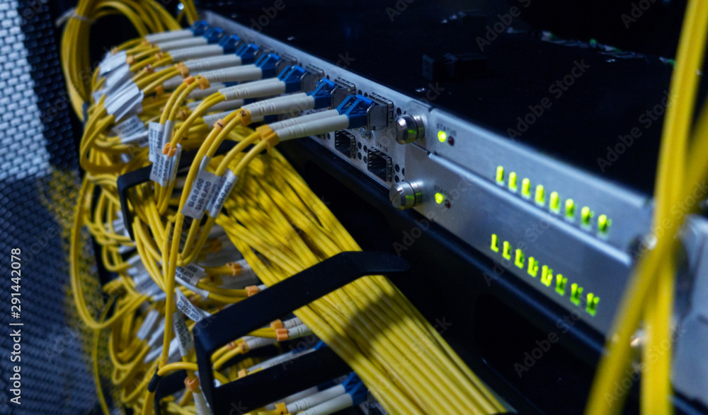 Oblongo identificación Gran universo Fiber optical cables patch panel and switch. foto de Stock | Adobe Stock