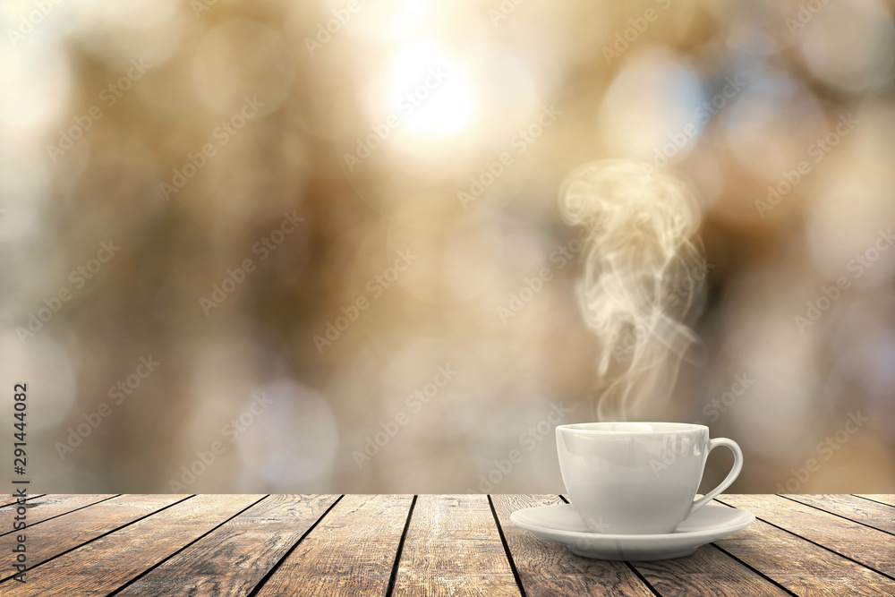 hot coffee on the table on a winter background - obrazy, fototapety, plakaty 