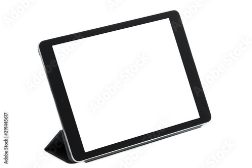 Tableta sobre fondo blanco en soporte gris derecha photo
