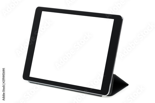 Tableta sobre fondo blanco en soporte gris izquierda photo