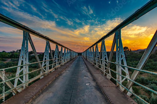 Sunset at the historic Lady de Waal bridge outside Steytlerville in the Karoo region of South Africa.