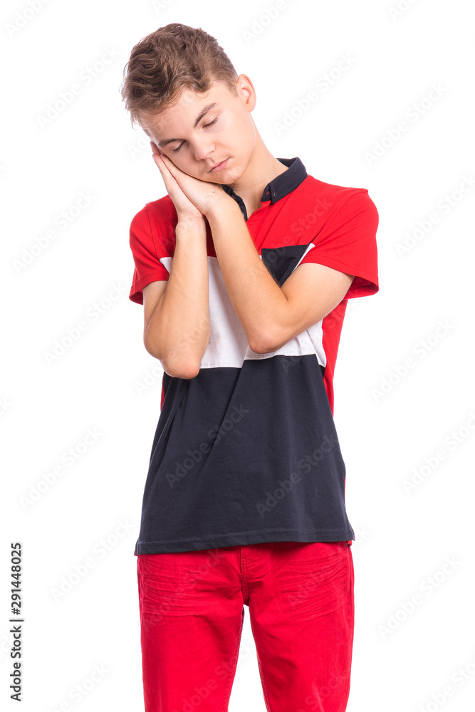Portrait of teen boy sleeping tired or dreaming posing with hands together while smiling with closed eyes. Cute young caucasian teenager isolated on white background. Happy child. Portrait of teen boy sleeping tired or dreaming posing with hands together while smiling with closed eyes. Cute young caucasian teenager isolated on white background. Happy child.
