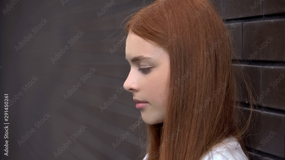Φωτογραφία Upset red-haired young woman, frustrated female teenager, melancholy sadness