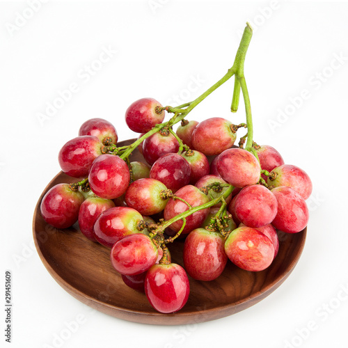 Fresh red grape isolated on white background.