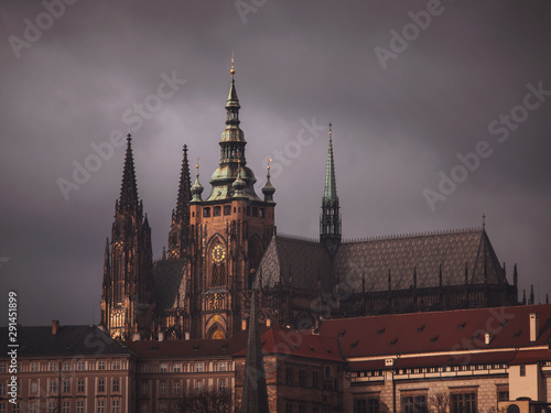 View of St. Vitus Cathedral, under a dark sky.