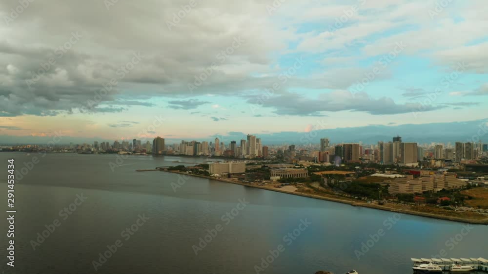 Manila city in the morning, view from above. Panorama of a large port city. City with modern buildings and skyscrapers. Manila, the capital of the Philippines. Asian metropolis. Manila city in the morning, view from above. Panorama of a large port city. City with modern buildings and skyscrapers. Manila, the capital of the Philippines. Asian metropolis.