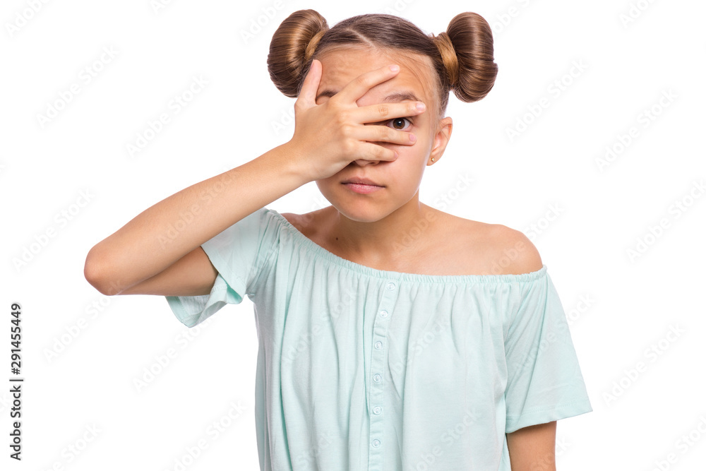 Scared teen girl cover face peeking through fingers. Child look through fingers hiding eyes. Emotional portrait of teenager isolated on white background. Scared teen girl cover face peeking through fingers. Child look through fingers hiding eyes. Emotional portrait of teenager isolated on white background.
