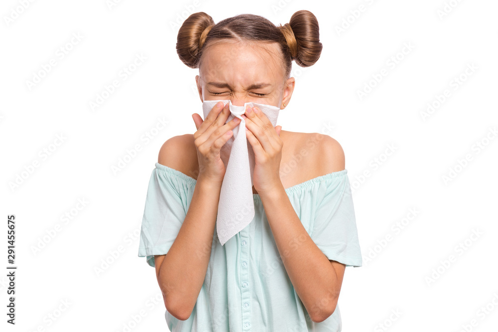 Portrait of unhealthy sick teen girl with napkin close her nose from allergy or rhinitis. Unhappy ill child suffering from running nose and sneezing and blow her nose isolated on white background.