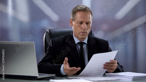 Boss checking reports, finding mistake in important contract, misunderstanding