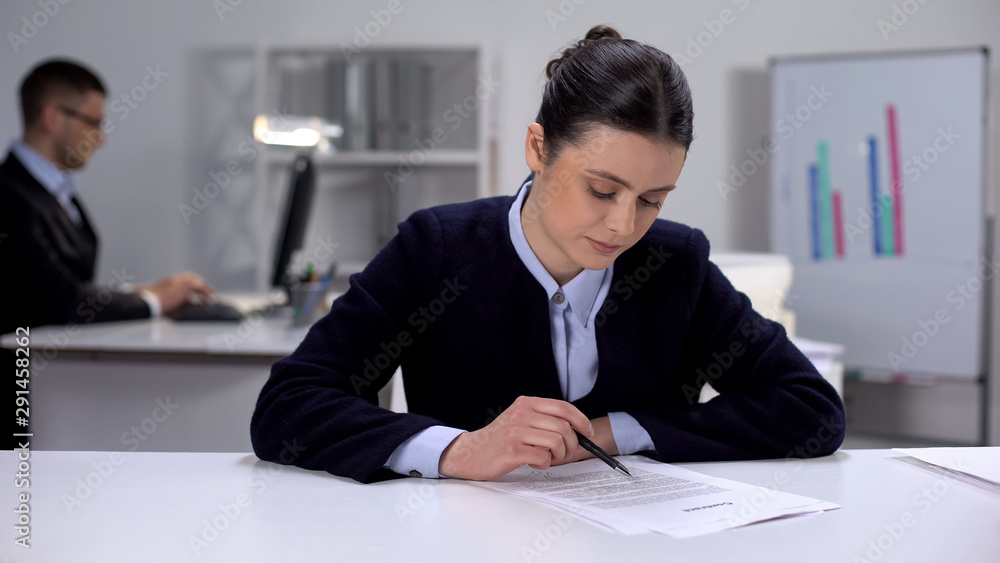 Female office manager working with documents, boring paper work, overworking Female office manager working with documents, boring paper work, overworking