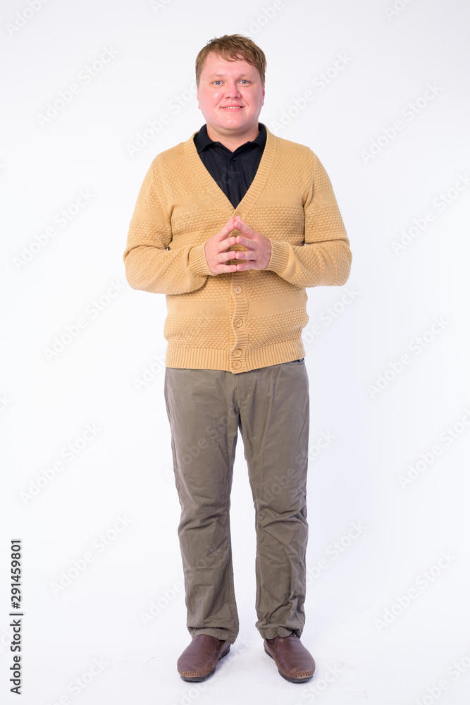 Full body shot of happy overweight man smiling Full body shot of happy overweight man smiling