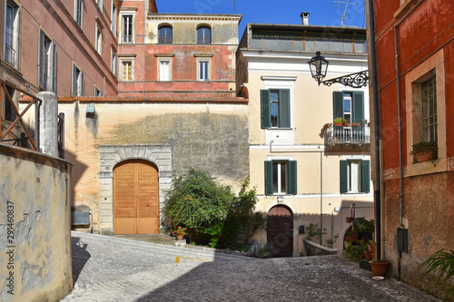 The small square of an old mountain town. the buildings are built in a traditional architectural style © Giambattista