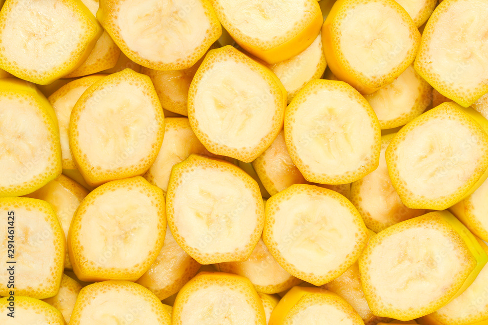 Fresh banana slices background. Top view.