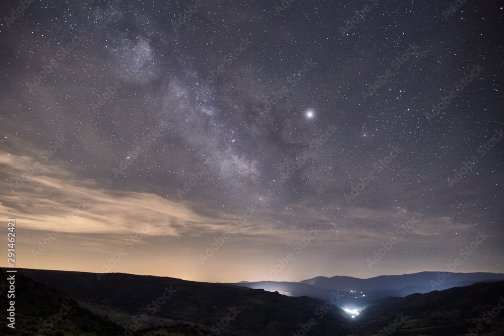image of the milky way galaxy over a small town image of the milky way galaxy over a small town