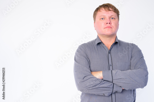 Portrait of overweight businessman with arms crossed © Ranta Images