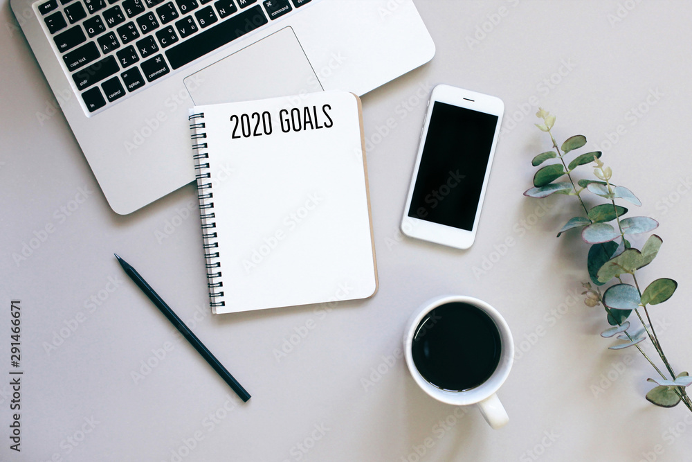 2020 goals on flat lay photo of workspace desk with smartphone, coffee, laptop and notebook with copy space background, minimal style and mockup concept 2020 goals on flat lay photo of workspace desk with smartphone, coffee, laptop and notebook with copy space background, minimal style and mockup concept