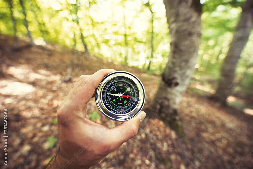 Naklejka premium man hand compass