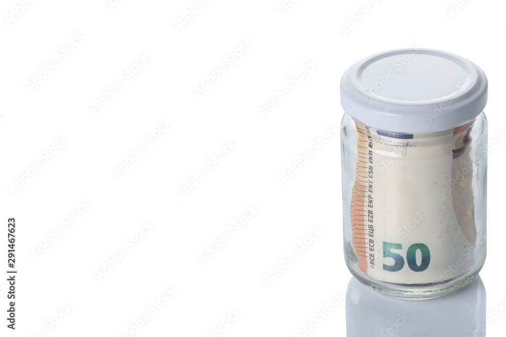 glass jar full of Euro currency banknotes isolated on white background with clipping path and copy space for your text glass jar full of Euro currency banknotes isolated on white background with clipping path and copy space for your text