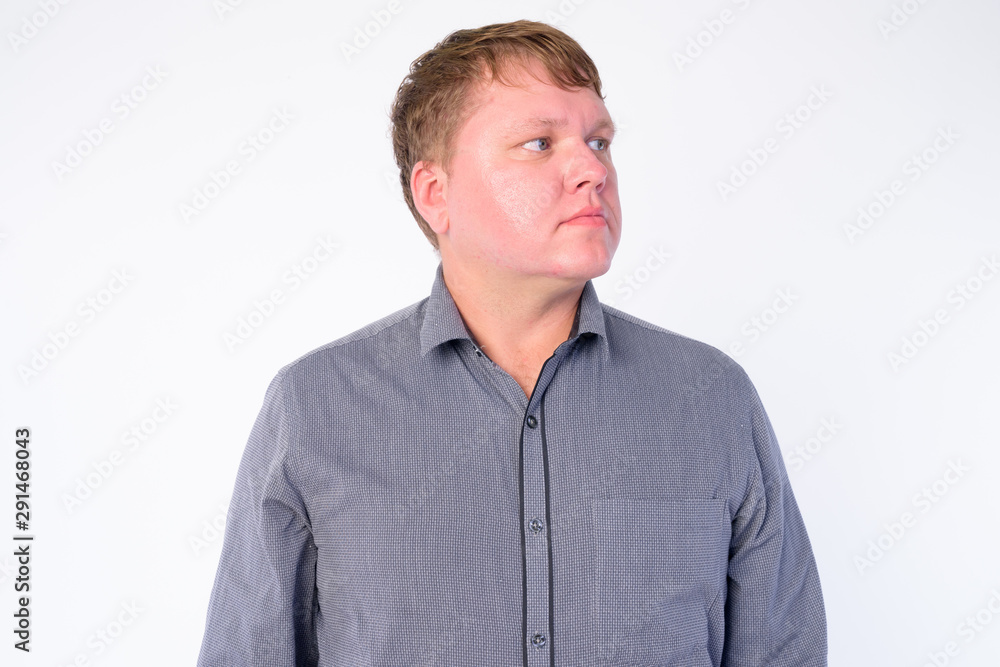 Face of overweight businessman thinking and looking up Face of overweight businessman thinking and looking up