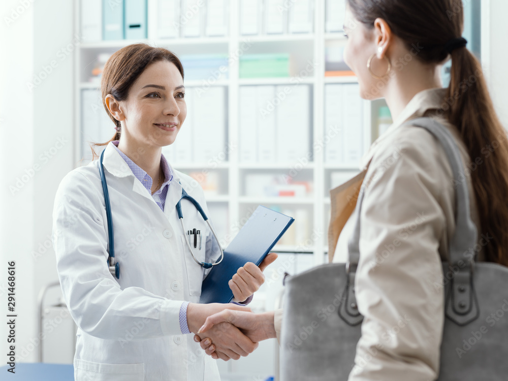 Doctor welcoming a young patient in the office Doctor welcoming a young patient in the office