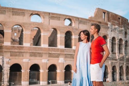 Happy family in Europe. Romantic couple in Rome over Coliseum background