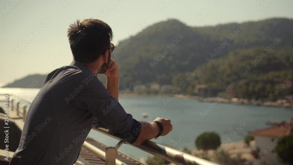 Businessman Drinking Tea On Vacation.Man Looking At Calm Sea And Drinking Coffee.Attractive Italian Man Looking At Sea.Man Drinking Coffee And Looking On Sea.Attractive Businessman In Sunglasses. Businessman Drinking Tea On Vacation.Man Looking At Calm Sea And Drinking Coffee.Attractive Italian Man Looking At Sea.Man Drinking Coffee And Looking On Sea.Attractive Businessman In Sunglasses.