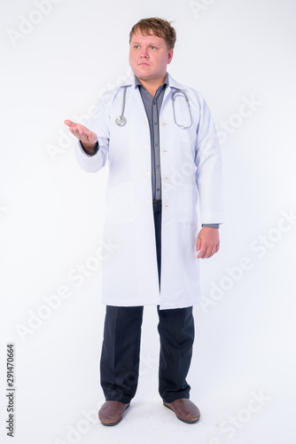 Full body shot of overweight man doctor talking