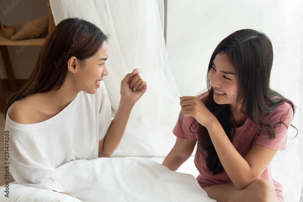 two happy women roommate talking, having fun and good time together two happy women roommate talking, having fun and good time together