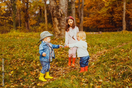 Cute children playing in the autumnal park