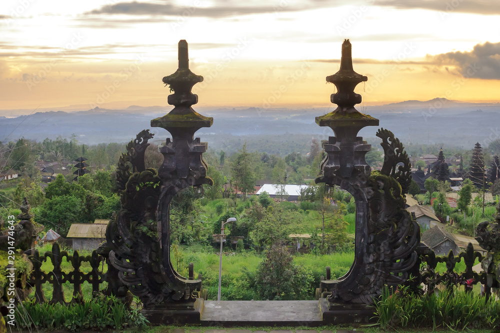 Fototapeta premium Summer tropical landscape at sunset and Pura Besakih on Bali, Indonesia