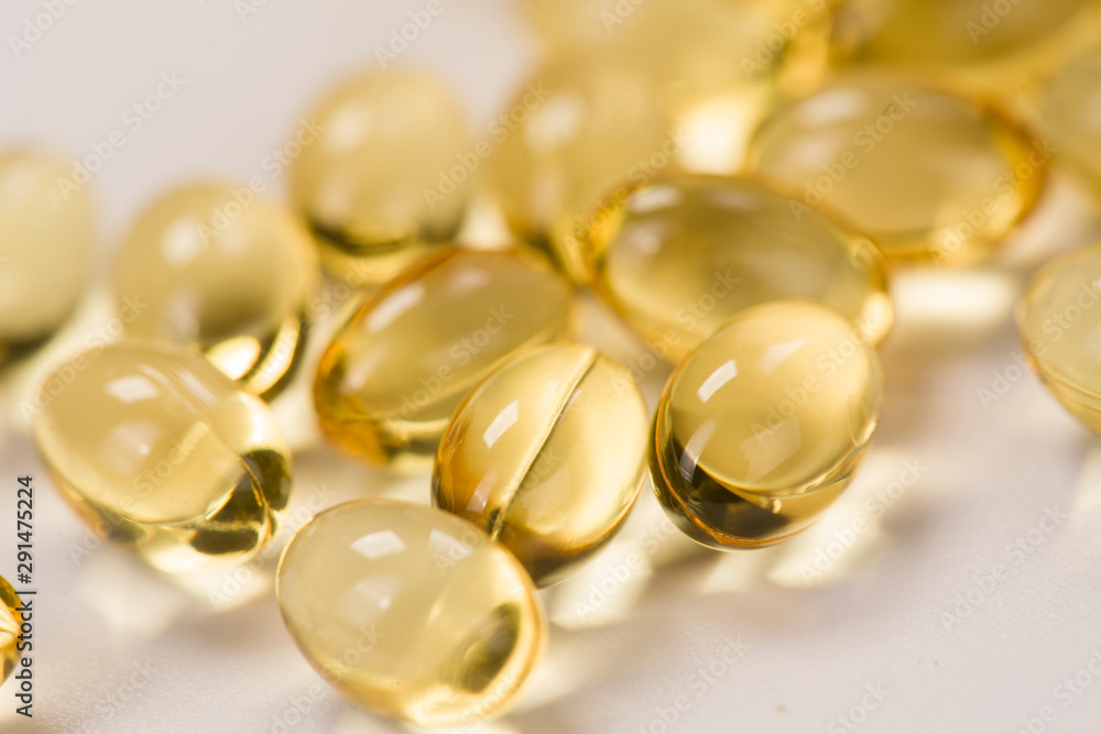 Closeup of fish oil capsules on white background Closeup of fish oil capsules on white background