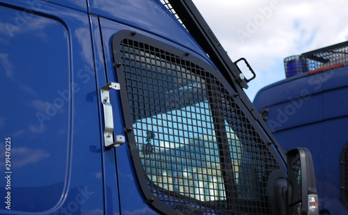 Police cars for transporting prisoners. Police buses with bars for protection at rallies and strikes.