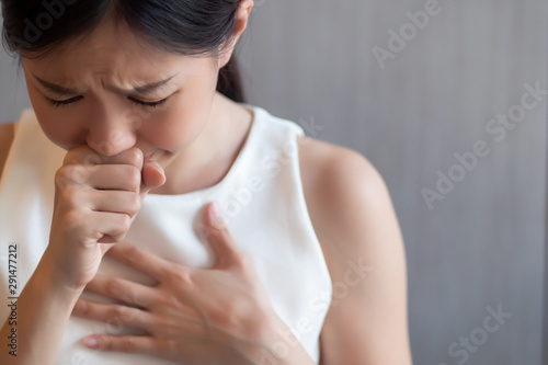 Obraz na plátně sick asian woman coughing, hiccupping, choking