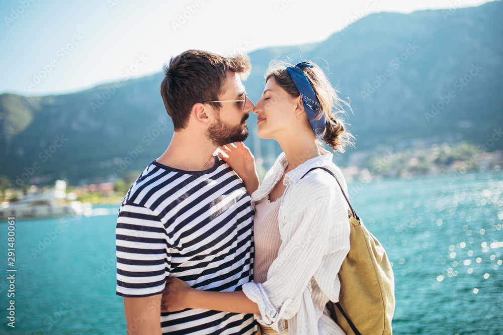 Portrait of a happy couple enjoying vacation on the sea.