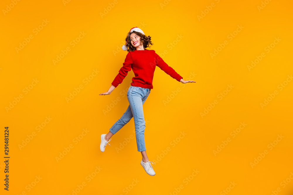 Full body photo of pretty lady jumping high walking down street wear knitted sweater isolated yellow background