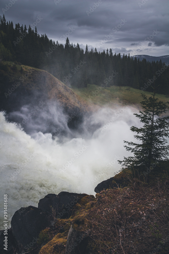 Waterfall Tannforsen in Sweden after rainy days. Waterfall Tannforsen in Sweden after rainy days.
