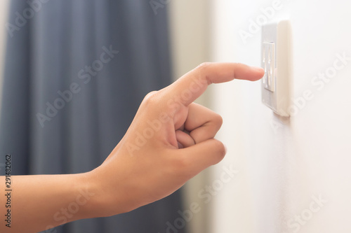 Obraz na plátně using electricity wall outlet with wet hand; electrocute danger concept
