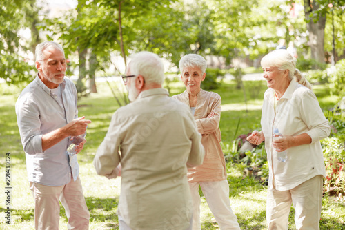 Senior people talking and laughing in the park