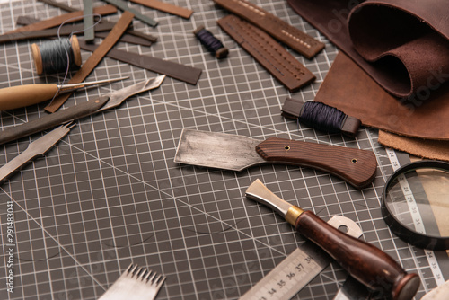 Leather craft tools on a cutting mat, workplace