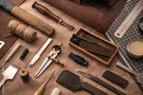 Leather craft tools on a cutting mat, flat lay, top view