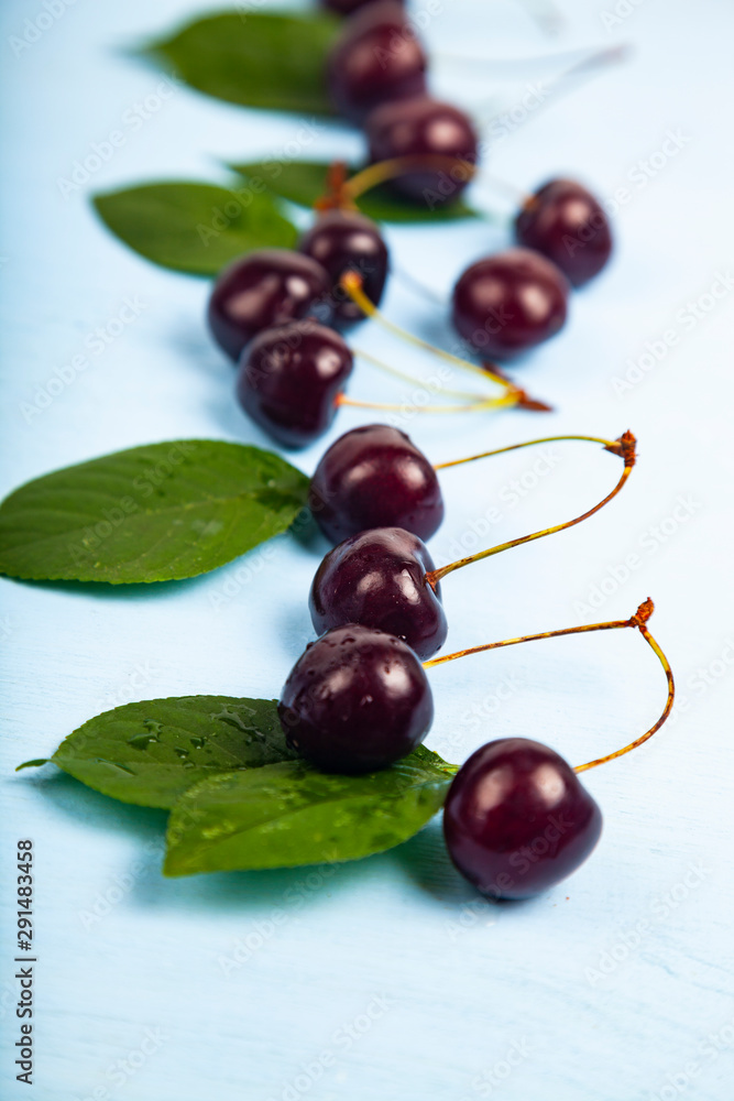 Ripe sweet cherry on a wooden table Ripe sweet cherry on a wooden table