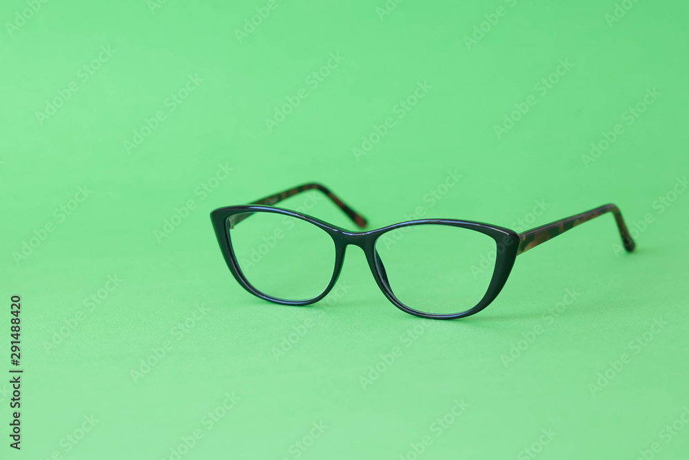 Fashionable stylish glasses on bright background. Optics. Vision. Fashionable stylish glasses on bright background. Optics. Vision.