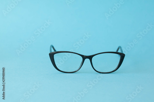 Fashionable stylish glasses on bright background. Optics. Vision.
