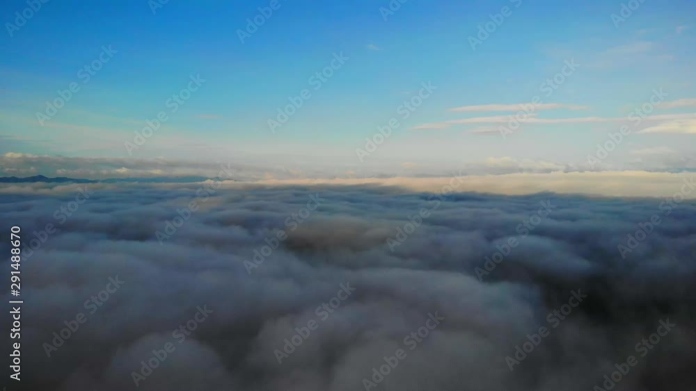 View from a drone flying over a cloud in the morning With the mountainous environment. View from a drone flying over a cloud in the morning With the mountainous environment.