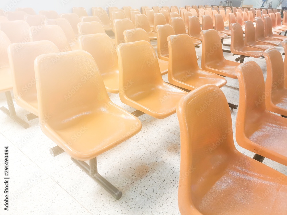 Fototapeta premium Close-up Orange Spectators seats at Office with copy space